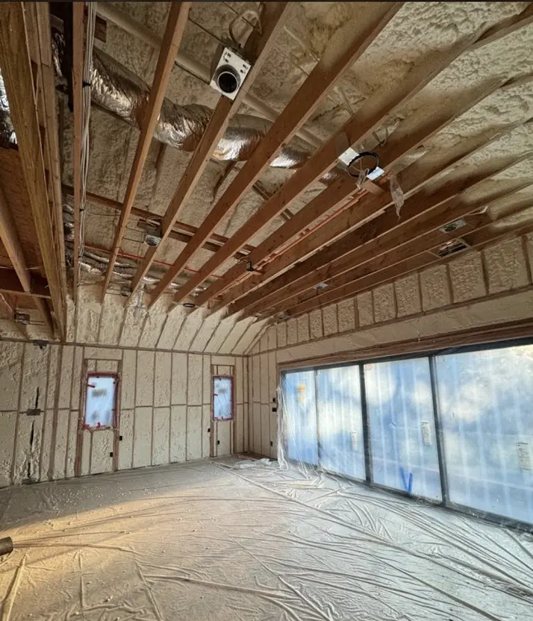 Interior walls and ceiling insulated with spray foam during new construction in Schiller Park